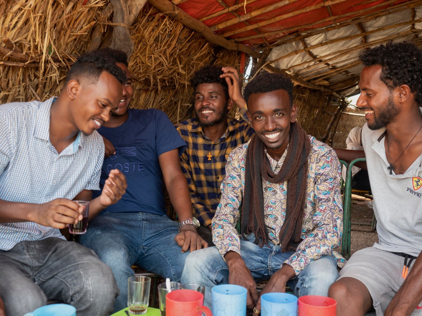 Aklilu and his friends at a cafe in UM RAKUBA refugee camp.
Photo: Ingrid Prestetun/NRC