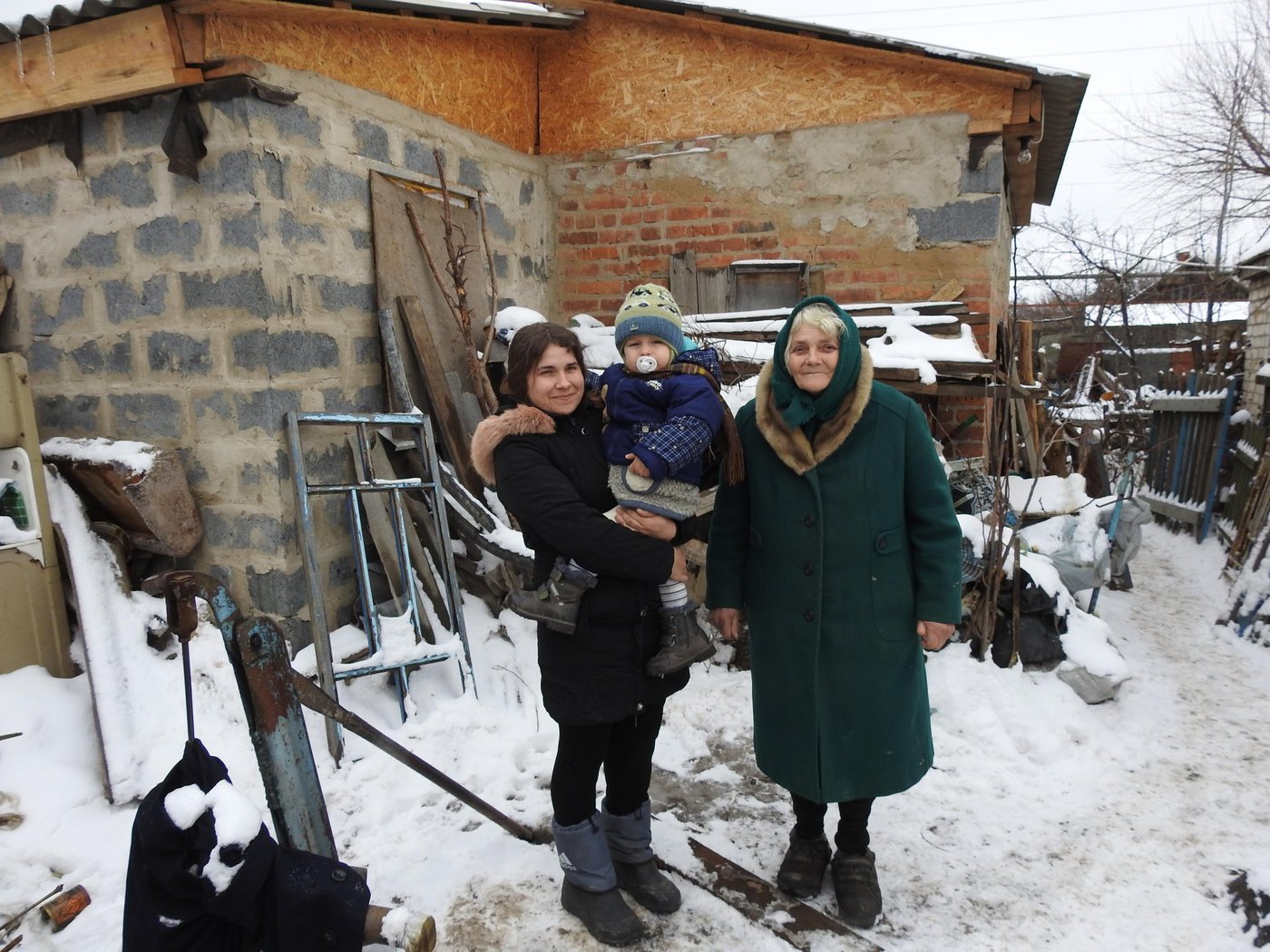 The house of 29-year-old Natalia Sokolova was one of the first, which was hit by hostilities in Stanytsia Luhanska: the roof and walls were significantly damaged. For more than three years, she lived in a small summer kitchen with her 70-year-old mother and small son, until in 2017 they received assistance from the Norwegian Refugee Council (NRC) under financial support of Vatican’s Initiative “Pope for Ukraine”.
“In the summer of 2014, I went to work. My mother stayed at home. She went out into the yard to look at the vegetable garden, but did not reach she fell from the blast. The shell hit the house and almost destroyed it. The same day four more houses were damaged at our street. It was only the beginning of war,” Natalia recalls.
Natalia and her mother Vira moved to live in a small summer kitchen near the house. They sought help from local authorities. Unfortunately, there was no money in the local budget. The situation was complicated by the fact that Natalia was pregnant and very worried about where and how she would live with her baby.
"When Savelii was born, only summer kitchen was suitable for living. However, it was very cramped and cold. In such circumstances, the baby started to catch up diseases, and we spent several months in hospitals. After discharge, we decided to go to my father to the village of Chuhynka, in Stanytsia Luhanska district. We lived there for almost a year, but still did not give up the dream of returning home,” Natalia tells.
Finally, in winter 2017, they were called from the village council and told about housing reconstruction project, which was implemented by the Norwegian Refugee Council with the financial support of the Vatican's Initiative “Pope for Ukraine”.
"At first we couldn't believe it was possible," Vira says. “They believed when they provided us with building materials and money to hire builders. My son covered the roof - he is the builder. We started construction in May and were able to move in after three months when the windows were installed,” Vera smiles.
Now Natalia and Vira are starting interior works, bring in water and equip the bathroom. There is still a lot of work to be done, but this family has numerous plans for the future and happy that they already live in small, but their own house.
In 2017, part of the NRC Shelter projects in Stanytsia-Luhanska district of Luhansk Region was funded through Vatican's Initiative “Pope for Ukraine”. 150 socially vulnerable families received construction materials to repair their house with minor damages and 13 families received construction materials and funds to rebuild their destroyed premises.
Photo: Anastasiia Karpilianska/NRC