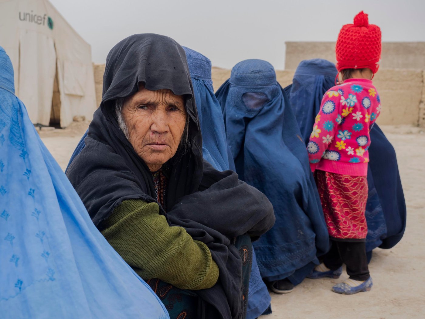 AFGHANISTAN/Mazar-i-Sharif
Nov 2019
Photo: Ingrid Prestetun /NRC 

Mama khal- Mahmood (67): at the NRC distributing point waiting to receive money to bay a stove and firewood for the winter.  

She is a widow and female HH living with her grandsons/ daughters. There are 16 members in her family. She is making wool waving to support her family and additionally her closed relatives collect money from people and support her on monthly basis with very small amount of money.

The family is included in NRC's shelter upgrade project and winterization program.