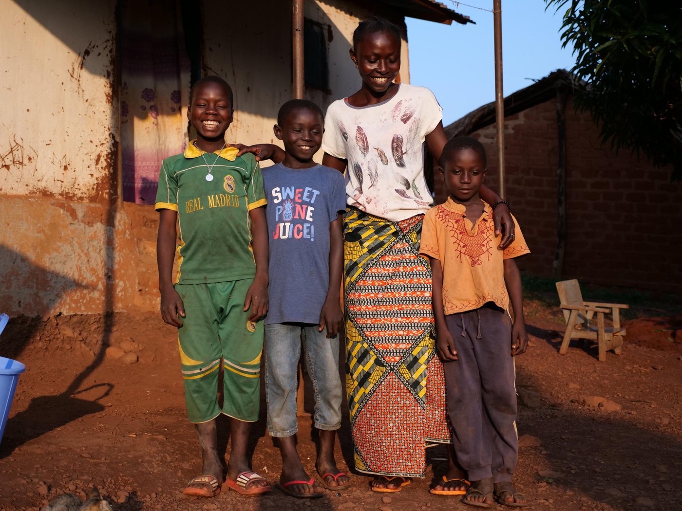 Nuela poses with three of her sons, Kolo, 10, Jospin, 8, and Cedric, 7 outside of their house in Boali, Central African Republic.
Photo: Itunu Kuku/NRC
Date: July 13 2021