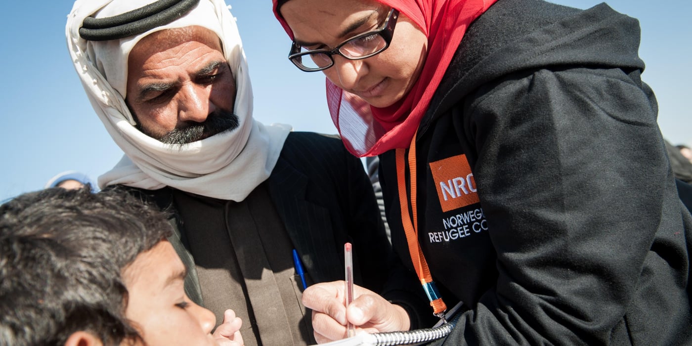 NRC ICLA team doing outreach work in an informal settlement for Syrian refguees in Wadi Khaled in Northern Lebanon. Photo credit: NRC/Christian Jepsen February 2014