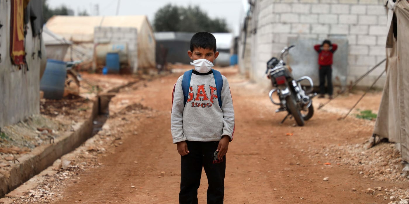 A Syrian boy poses for a picture during an awareness workshop on coronavirus (COVID-19) at a camp for displaced people in Atme town in Syria's northwestern Idlib province, near the border with Turkey. Photo: AAREF WATAD / AFP / NTB Scanpix