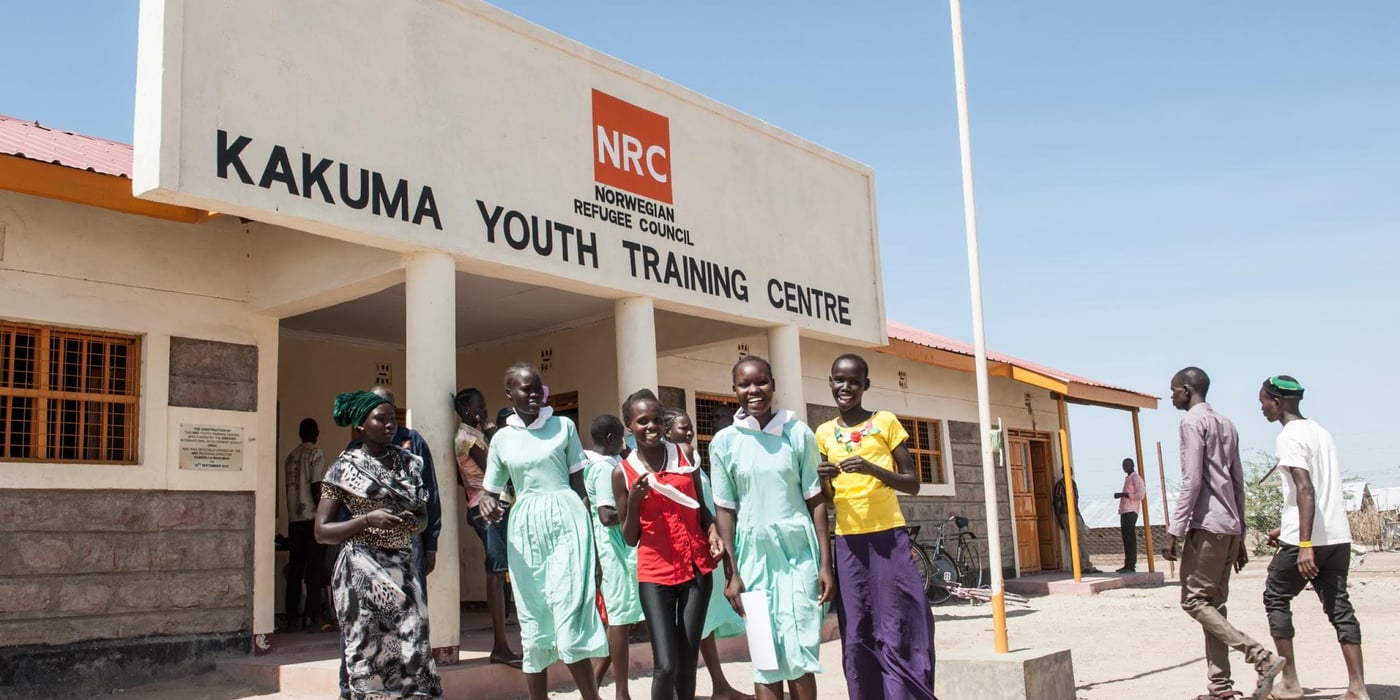 Young girls who are vocational learners at Kakuma youth training centre share some laughter with the photographer. Photo: Christian Jepsen