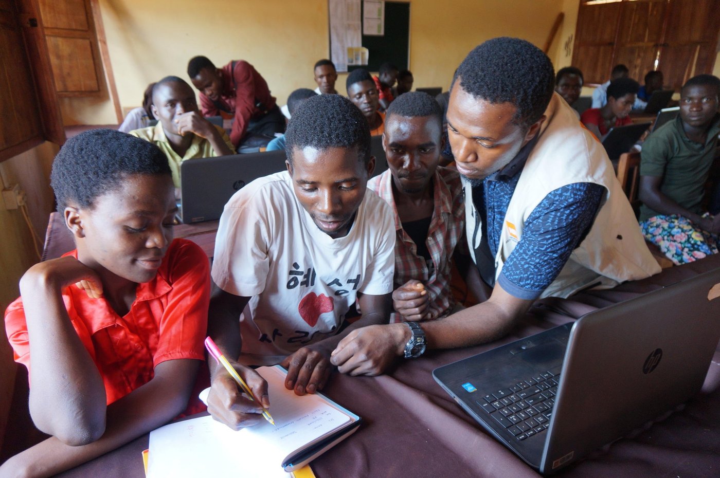 Deogratius Kimena – ICT teacher, 27
with Festo Philipo Emmanuel, 23, host community youth attending ICT classes in Mtendeli refugee camp.
and Nizigama Jenovanie, 22, refugee from Burundi:
“I came here in 2015. I’m thankful for these trainings, I’m learning a lot that I didn’t know before, like how to write letters, modify pictures and other things. After this, I’d like to get a job as a computer trainer. I want to be a teacher.”
Photo: Guri Romtveit/NRC