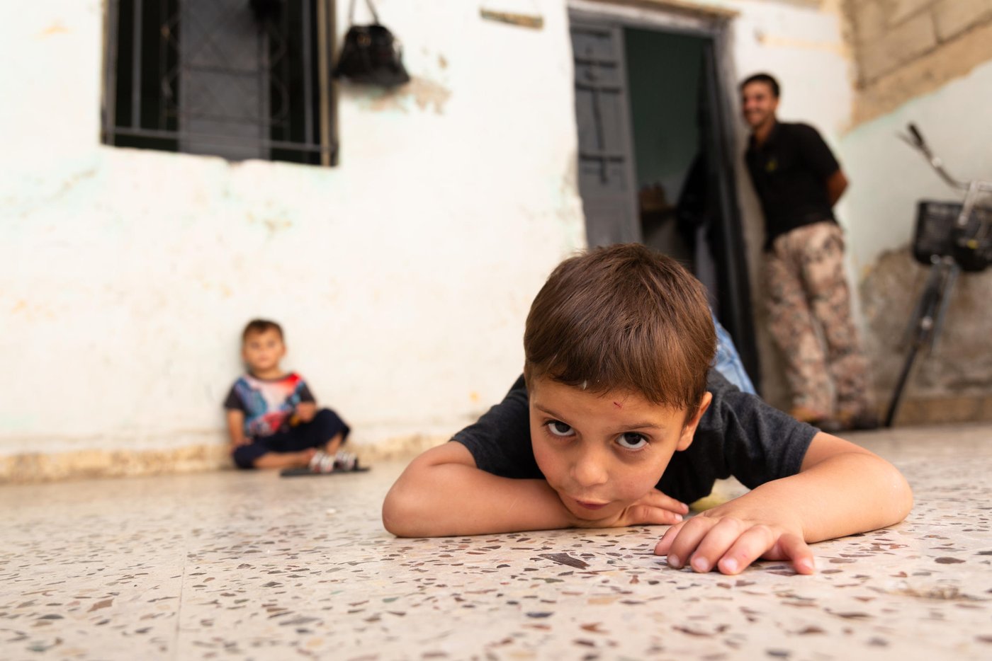 Bassam, Mohammad's child poses for a picture.
“I thought that I would come to Jordan for a month, two months...a year or two, but I have stayed here to this day. Now there is no hope of returning to Syria. Our city Homs was badly destroyed, our house was levelled because of the bombing”
Muhammad is a Syrian refugee from Homs. He fled Syria in 2012 to Jordan and now lives in Mafraq city in northeastern Jordan. Muhammad never thought that he would be a refugee in Jordan drying bread for a living, which is the only option he now has to provide a simple income for his family.
Capture date: 26/09/2021
Photo: Sherbel Dissi/ NRC