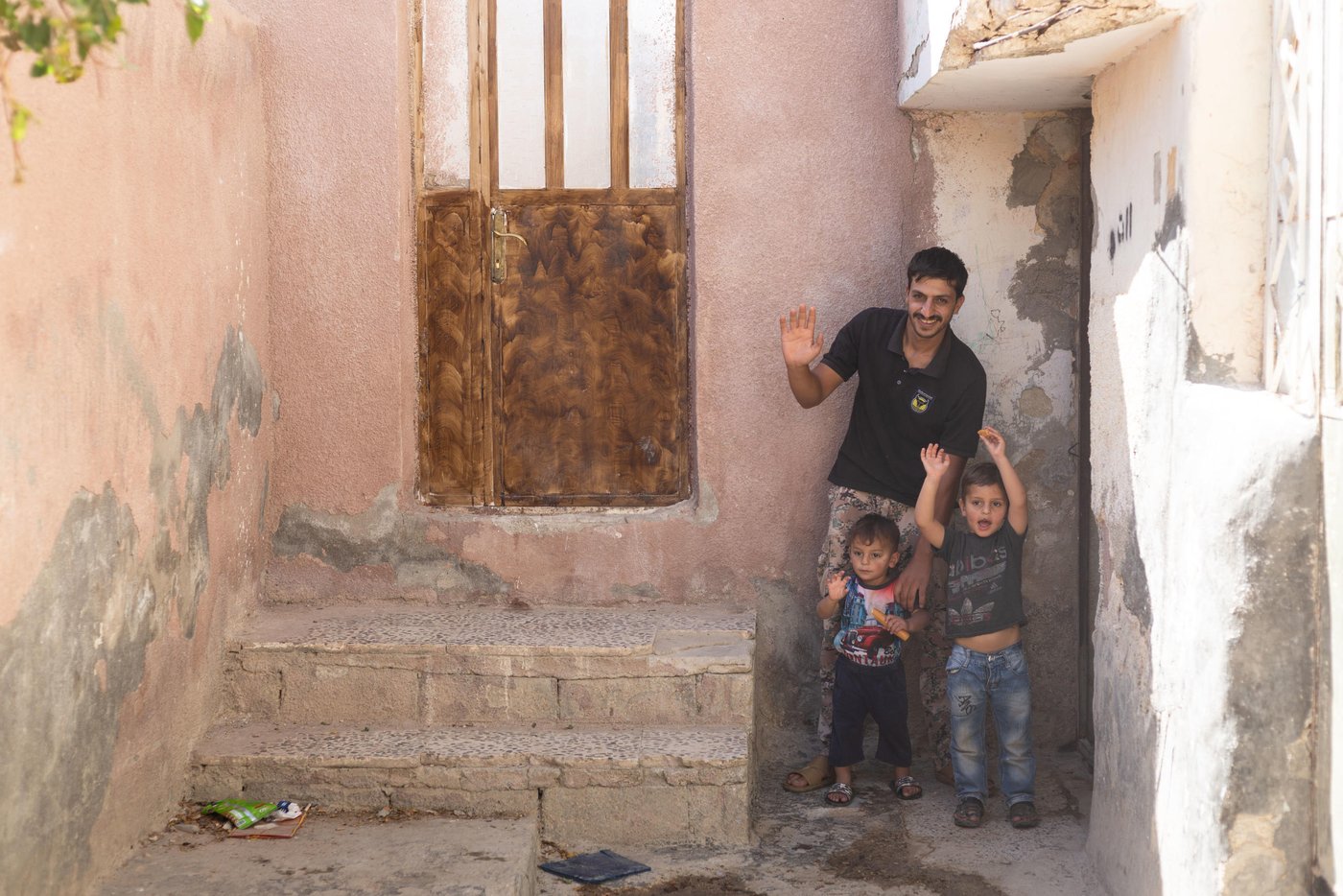 Muhammad and his two children Bassam and Hussam waving goodbye to the NRC shelter team.
“I thought that I would come to Jordan for a month, two months...a year or two, but I have stayed here to this day. Now there is no hope of returning to Syria. Our city Homs was badly destroyed, our house was levelled because of the bombing”
Muhammad is a Syrian refugee from Homs. He fled Syria in 2012 to Jordan and now lives in Mafraq city in northeastern Jordan. Muhammad never thought that he would be a refugee in Jordan drying bread for a living, which is the only option he now has to provide a simple income for his family.
Capture date: 26/09/2021
Photo: Sherbel Dissi/ NRC