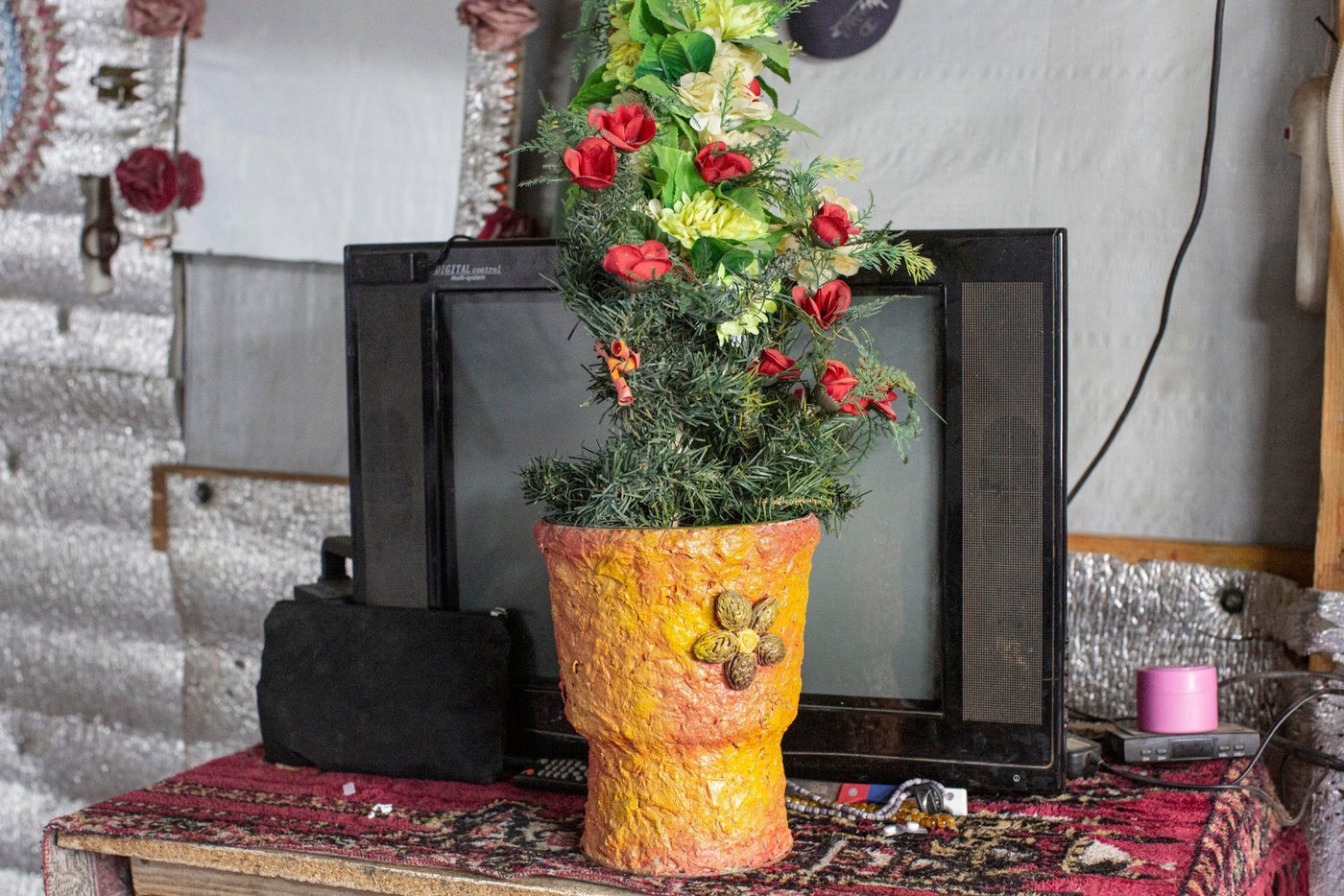 A handmade up-cycled plant pot on in tent belonging to Fatima Toumas, (47), and her family, in an informal settlement in the Bekaa Valley, Lebanon, on November 3rd, 2020.
The family fled to Lebanon from their home in Syria after being caught up in the war there, in 2013.
They moved into their current tent in 2006.Thanks to wood supplied by NRC, the family have been able to double the size of their home since they first bought it from its previous tenant. NRC also supplied and maintains toilets in their settlement, supplies water for drinking and washing, hygiene kits and waterproofing materials.
_____________________
Photo: Sam Tarling/NRC