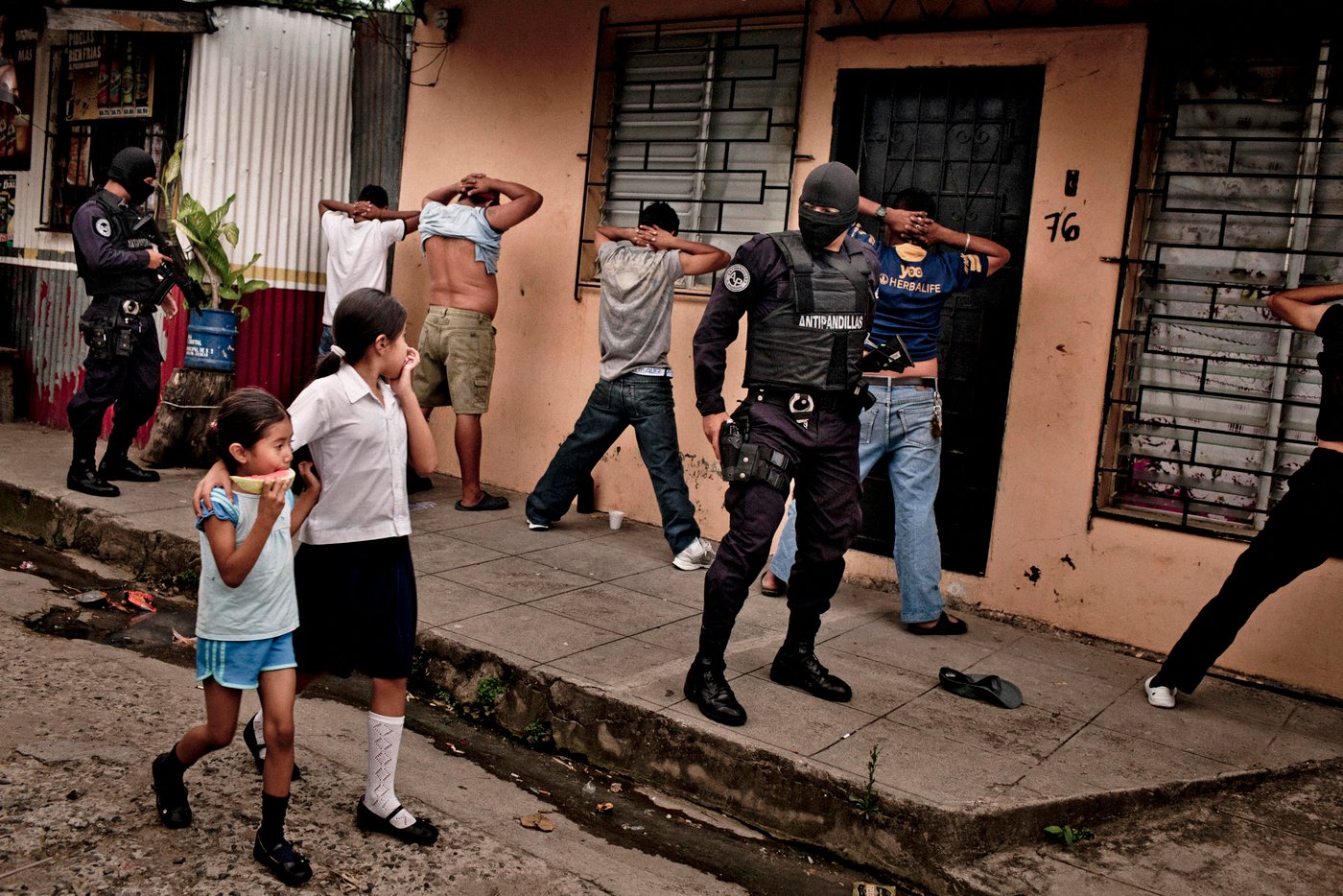 FILE -- An anti-gang police unit searches young men for weapons, or tattoos identifying them as members of a gang, in San Salvador, El Salvador, Aug. 14, 2012. Nearly 200,000 people from El Salvador who, after being allowed to live in the U.S. for more than a decade, will have to leave the country because the Trump administration is reportedly ending a humanitarian program, known as Temporary Protected Status. (Tomas Munita/The New York Times)