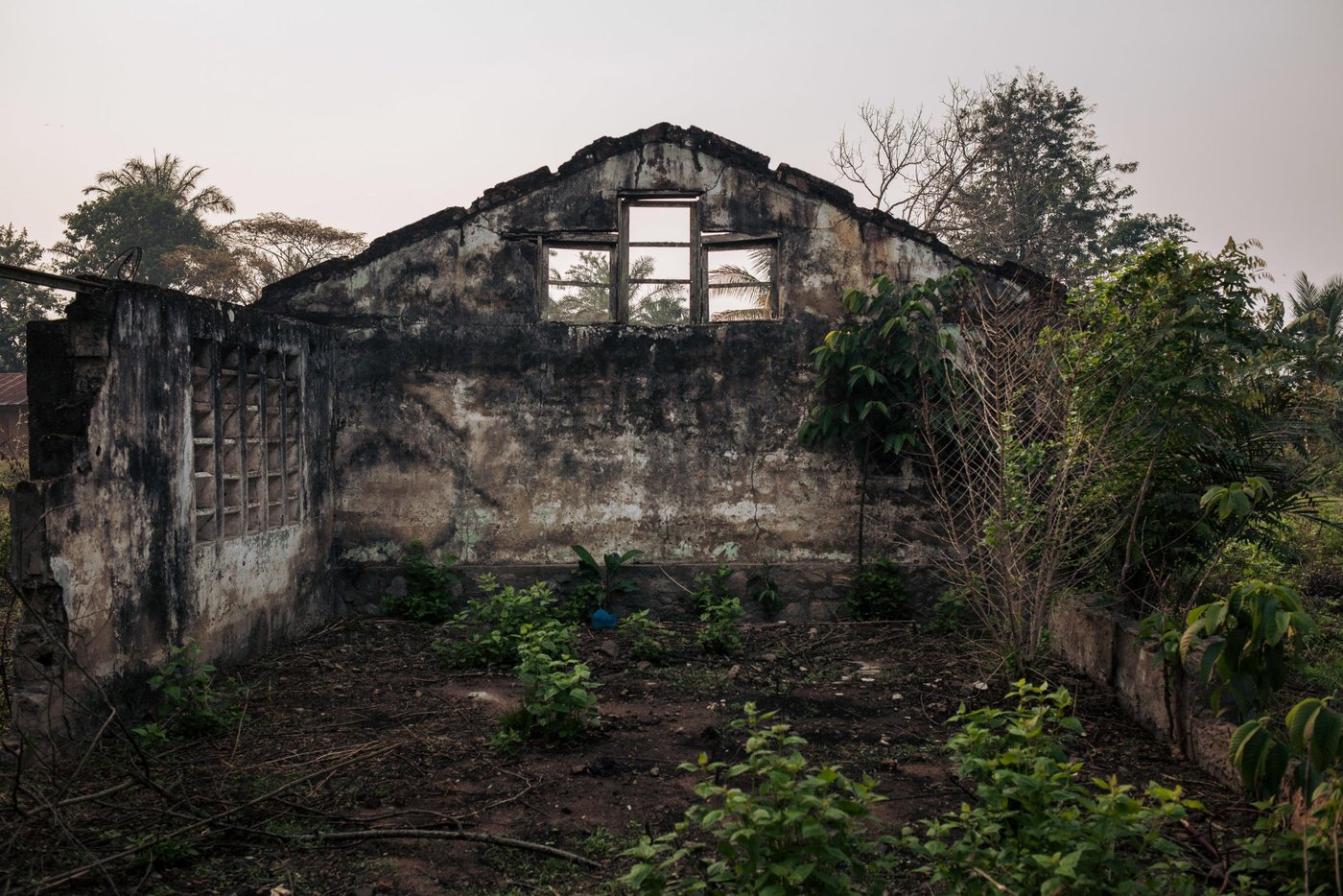 View of the ruins of an administrative building in the village of Mbulungu. In early 2017, armed militias took control of the area. They systematically destroyed official buildings and attacked government officials.
Over 1 million people have returned to their homes in Kasai-Central after a year of violent conflict within the province and across the Greater Kasai Region. Unfortunately, people who have returned have found their homes and fields pillaged and burned to the ground. These farming communities have no shelter, no food to eat and no means of sustaining any viable livelihood.
Earlier this year, NRC visited Mbulungu and Bakuakashila, two villages ravaged by the regional conflict in 2017. NRC used its “community-based approach” by consulting with these communities to better understand their primary needs, to properly target the most vulnerable people and facilitate their ability to choose the assistance they require.
This intervention, however, is only a drop in the ocean of the vast needs of this community. NRC is currently the only humanitarian actor in the zone and funding is not enough to address other acute needs such as food assistance, household items and education. The Humanitarian Response Plan is currently only 25 per cent funded eight months into the year. Humanitarian capacity is critically low. If donors do not act now for the people of Mbulungu and for the rest of DR Congo, it will be too late.
August 29, 2018 - Kasai-Central Province, DR Congo
Photo: NRC/Aléxis Huguet