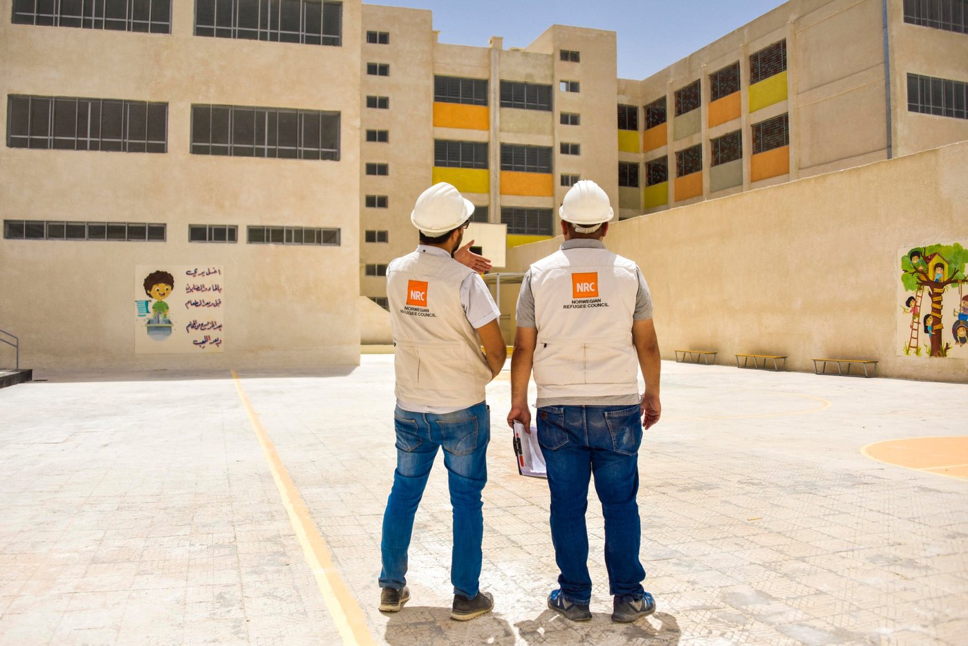 "NRC’s Shelter team finalizing the rehabilitation process of an elementary school in Barzeh.
Schools are rehabilitated with new colours and designs that are more encouraging and child friendly"
Photo: Tareq Mnadili/NRC