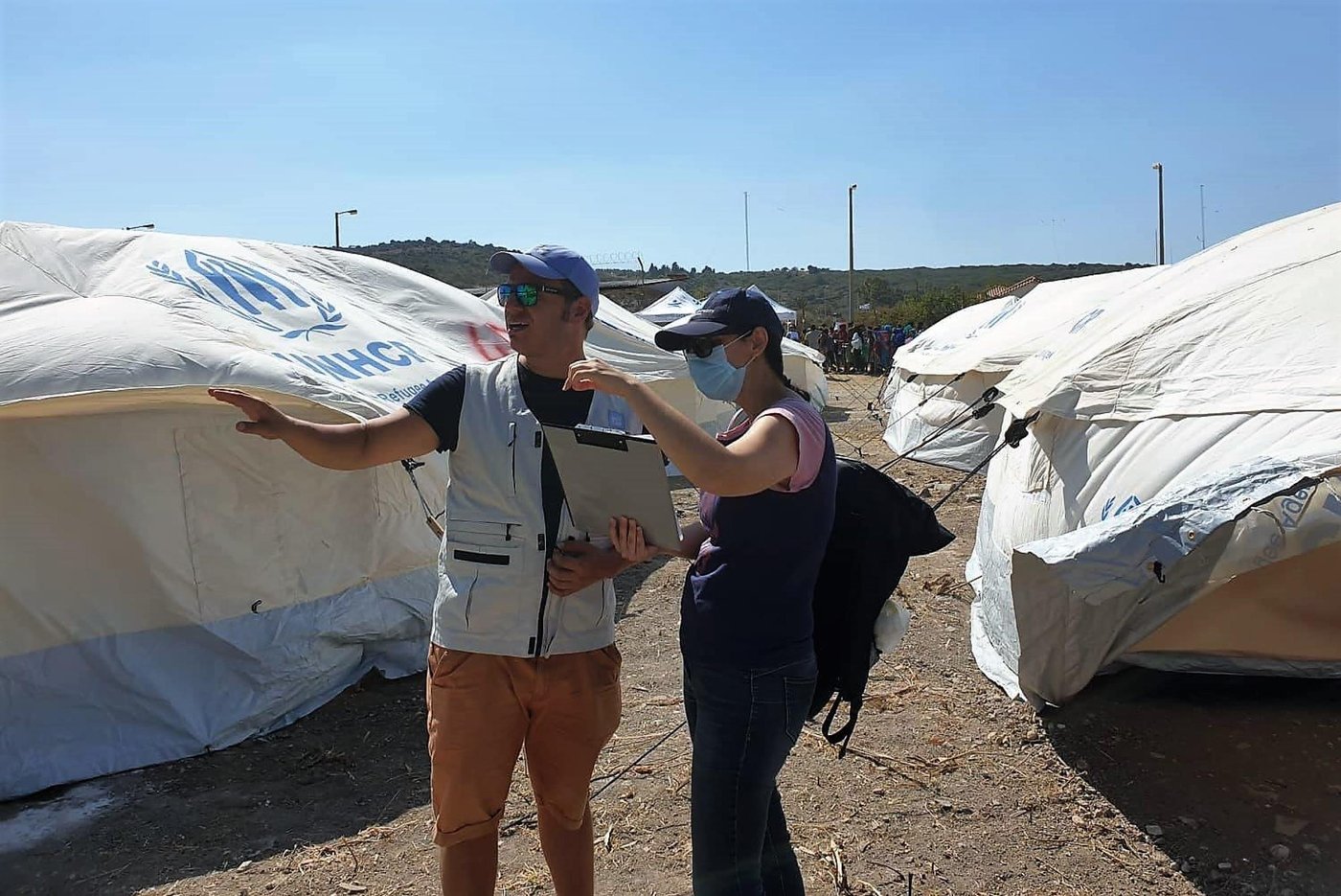 Site planner Haroula Gialama (right) and Programme adviser Kostas Karagiannis are deployed to Moria to help set up a new camp for the refugees and migrants who lost their shelters during the fires in Moria last week. (Photo: NORCAP/Alkisti Mavraki) September 2020.