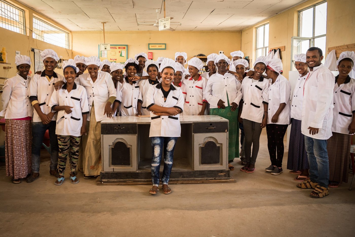 Eden Tedros, 20 years old, from Eritrea, posing with her cooking class  in Hitsats refugee camp, Ethiopia.

"I want to travel to Europe, but I want to travel safely," says 20-year-old Eden Tedros. 

She tells us that a growing number of young Eritreans choose to leave their home country. Tedros is one of many who left in fear of spending her whole life in the military.

Tedros has lived as a refugee in Hitsats refugee camp in northern Ethiopia since June 2017. The closest city is far away and the refugees survive on food and water rations.

For many children and youth in Hitsats refugee camp, it’s hard to imagine a future in Ethiopia. Four out of ten refugees leave Shire after three months. But Tedros has an opportunity to live out her dream.

She is studying to become a certified chef at NRC’s youth education centre in Shire.

"My biggest dream is to work in a restaurant in Europe.” 

Many young Eritreans opt to leave their home country through dangerous migration routes to escape poverty. 

But Tedros is hesitant to travel the seaway across the Mediterranean.

In 2017, over 300,000 refugees and migrants drowned during their attempt to cross the ocean.

“I don’t think I will travel the dangerous route.”

Photo: Beate Simarud/NRC Facts and figures:

Eritreans are the third largest group of refugees living in Ethiopia, with 37,321 refugees currently registered in refugee camps in the Shire area camps. 

Currently there are 163,281 Eritrean refugees in Ethiopia.

It is estimated that nearly 40 per cent of Eritrean refugees leave the camps within the first three months of arrival, and 80 per cent leave within the first year, with significant numbers of the population departing irregularly from Ethiopia to third countries – often with the assistance of smugglers and at great risk to their lives. 

The population in the Shire camps is unique, with a large number of children below the age of 18 and unaccompanied children. 

As of June 2017, 72 per cent of the refugees living in Shire were under the age of 18, including 4,725 unaccompanied and separated children, representing approximately 11.5 per cent of the total refugee population. 

Unaccompanied and separated children live in a variety of care arrangements, including community care, foster care, or family-based care.