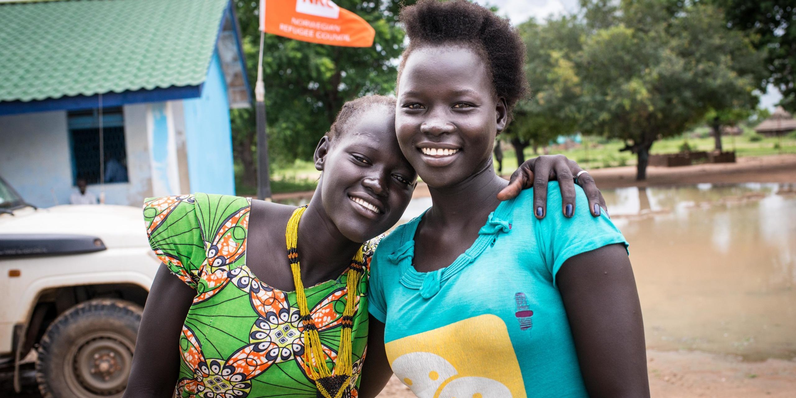 Elizabeth Kuach, 16, and Mary Aduol, 18, stand outside NRC's youth center in Gordhim, South Sudan. Elizabeth and Mary are studying full-time in the YEP centre, learning basic numeracy and literacy as well as vocational skills such as baking, carpentry, and agriculture. "We like learning in the center because we learn something new every day," said Mary Aduol. Photo by David Belluz/NRC 2017