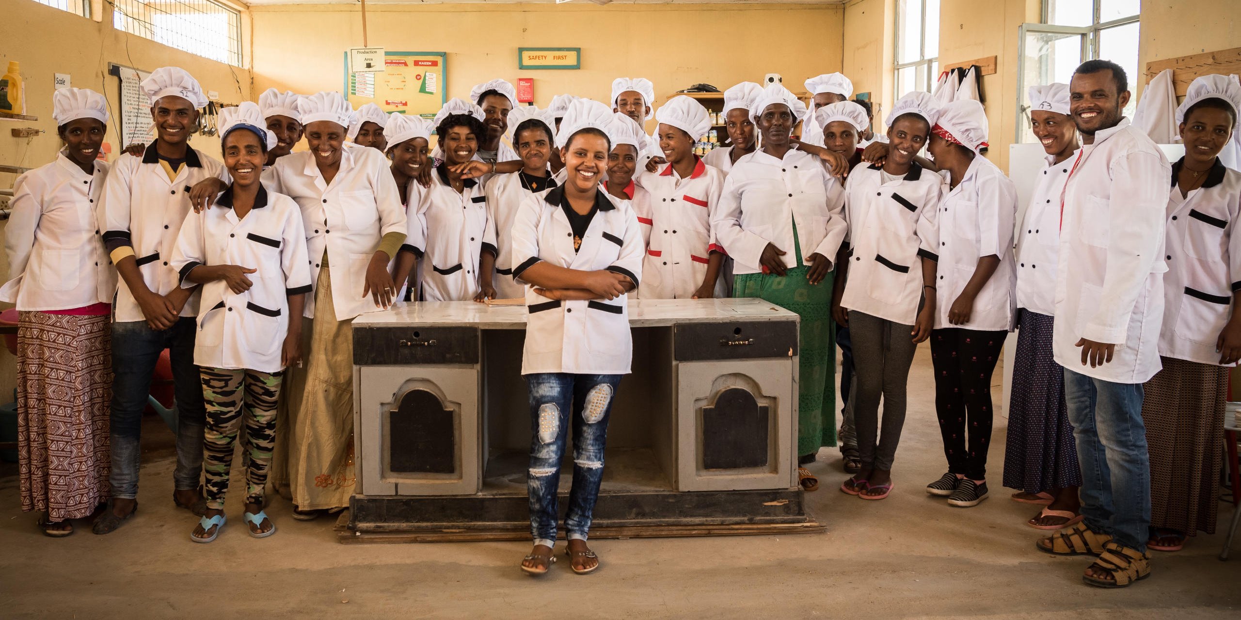 Eden Tedros, 20 years old, from Eritrea, posing with her cooking class in Hitsats refugee camp, Ethiopia.
"I want to travel to Europe, but I want to travel safely," says 20-year-old Eden Tedros.
She tells us that a growing number of young Eritreans choose to leave their home country. Tedros is one of many who left in fear of spending her whole life in the military.
Tedros has lived as a refugee in Hitsats refugee camp in northern Ethiopia since June 2017. The closest city is far away and the refugees survive on food and water rations.
For many children and youth in Hitsats refugee camp, it’s hard to imagine a future in Ethiopia. Four out of ten refugees leave Shire after three months. But Tedros has an opportunity to live out her dream.
She is studying to become a certified chef at NRC’s youth education centre in Shire.
"My biggest dream is to work in a restaurant in Europe.”
Many young Eritreans opt to leave their home country through dangerous migration routes to escape poverty.
But Tedros is hesitant to travel the seaway across the Mediterranean.
In 2017, over 300,000 refugees and migrants drowned during their attempt to cross the ocean.
“I don’t think I will travel the dangerous route.”
Photo: Beate Simarud/NRC Facts and figures:
Eritreans are the third largest group of refugees living in Ethiopia, with 37,321 refugees currently registered in refugee camps in the Shire area camps.
Currently there are 163,281 Eritrean refugees in Ethiopia.
It is estimated that nearly 40 per cent of Eritrean refugees leave the camps within the first three months of arrival, and 80 per cent leave within the first year, with significant numbers of the population departing irregularly from Ethiopia to third countries – often with the assistance of smugglers and at great risk to their lives.
The population in the Shire camps is unique, with a large number of children below the age of 18 and unaccompanied children.
As of June 2017, 72 per cent of the refugees living in Shire were under the age of 18, including 4,725 unaccompanied and separated children, representing approximately 11.5 per cent of the total refugee population.
Unaccompanied and separated children live in a variety of care arrangements, including community care, foster care, or family-based care.
