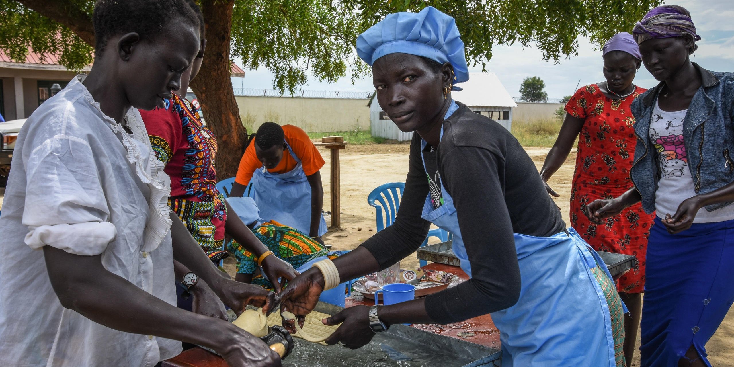 Mary (32) (left) and Monika (30) are making biscuits at NRC's youth education center in Bor. Photo: NRC/Tiril Skarstein