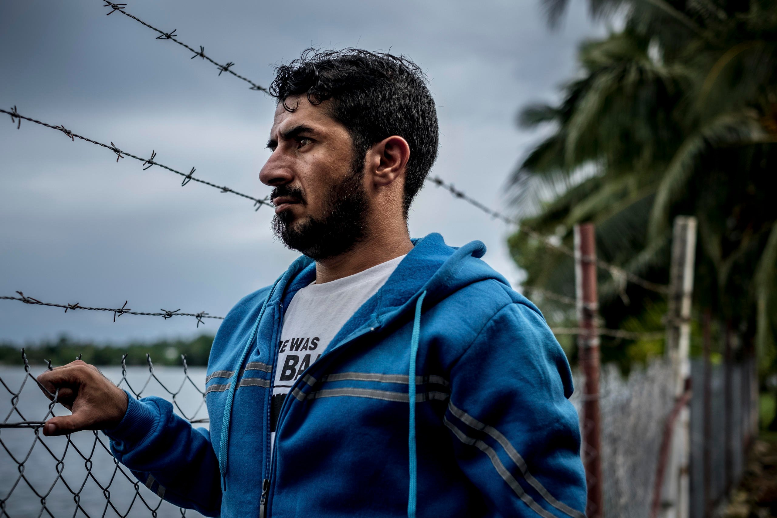 Behnam Satah, a Kurdish refugee who holds a masterâä? s in English education, on Manus Island, Papua New Guinea, Nov. 16, 2016. The refugees banished by Australia to quasi-prisons in the South Pacific are experiencing some of the most brutal and sinister exercises conducted in near secrecy beneath the green canopy of the tropics. âä? Sometimes I cut myself so that I can see my blood and remember, âä? Oh, yes! I am alive,'" Satah said. (Ashley Gilbertson/The New York Times)