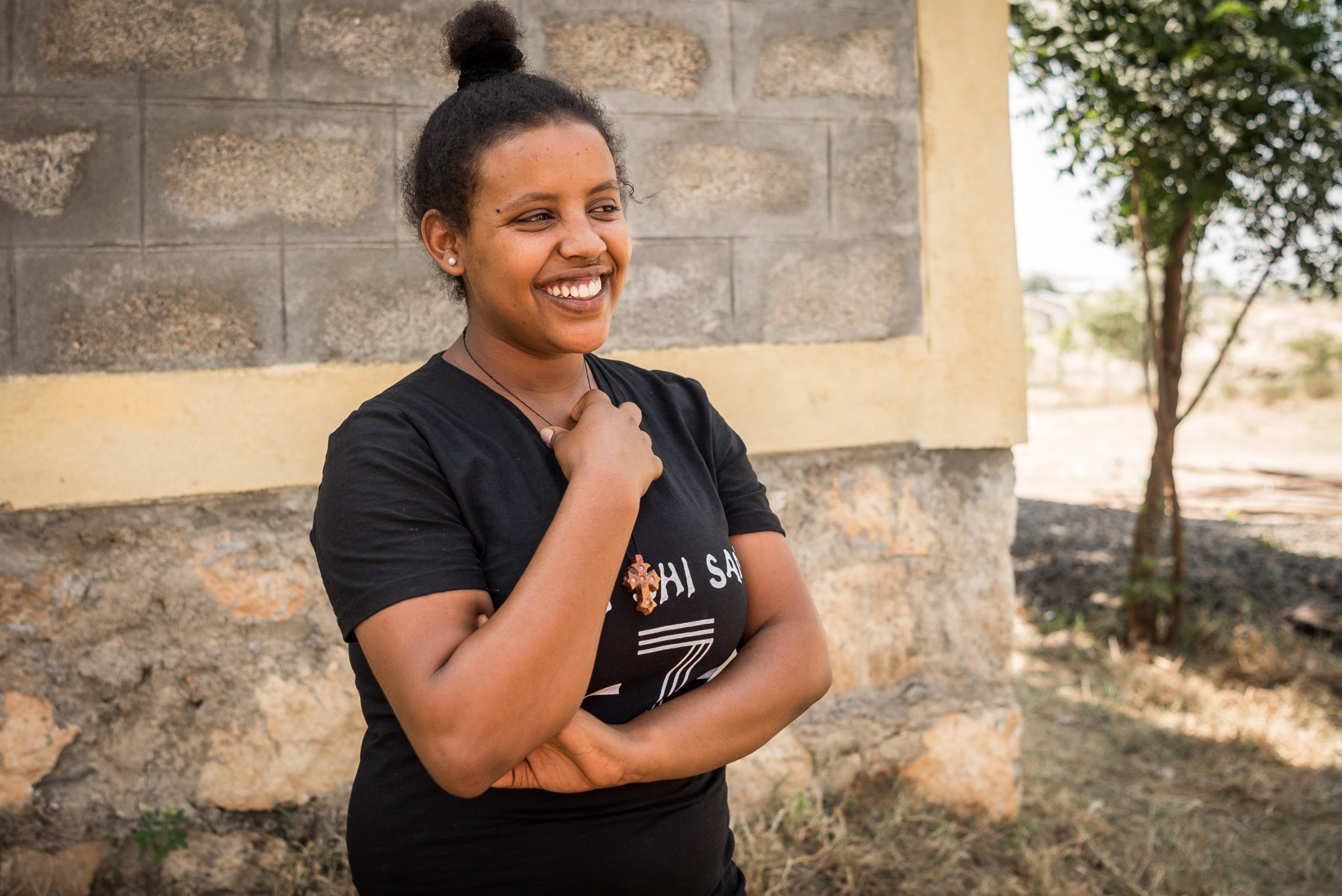 Eden Tedros, 20 years old, from Eritrea.
"I want to travel to Europe, but I want to travel safely," says 20-year-old Eden Tedros.
"I want to travel to Europe, but I want to travel safely," says 20-year-old Eden Tedros.
She tells us that a growing number of young Eritreans choose to leave their home country. Tedros is one of many who left in fear of spending her whole life in the military.
Tedros has lived as a refugee in Hitsats refugee camp in northern Ethiopia since June 2017. The closest city is far away and the refugees survive on food and water rations.
For many children and youth in Hitsats refugee camp, it’s hard to imagine a future in Ethiopia. Four out of ten refugees leave Shire after three months. But Tedros has an opportunity to live out her dream.
She is studying to become a certified chef at NRC’s youth education centre in Shire.
"My biggest dream is to work in a restaurant in Europe.”
Many young Eritreans opt to leave their home country through dangerous migration routes to escape poverty.
But Tedros is hesitant to travel the seaway across the Mediterranean.
In 2017, over 300,000 refugees and migrants drowned during their attempt to cross the ocean.
“I don’t think I will travel the dangerous route.”
Photo: Beate Simarud/NRC Facts and figures:
Eritreans are the third largest group of refugees living in Ethiopia, with 37,321 refugees currently registered in refugee camps in the Shire area camps.
Currently there are 163,281 Eritrean refugees in Ethiopia.
It is estimated that nearly 40 per cent of Eritrean refugees leave the camps within the first three months of arrival, and 80 per cent leave within the first year, with significant numbers of the population departing irregularly from Ethiopia to third countries – often with the assistance of smugglers and at great risk to their lives.
The population in the Shire camps is unique, with a large number of children below the age of 18 and unaccompanied children.
As of June 2017, 72 per cent of the refugees living in Shire were under the age of 18, including 4,725 unaccompanied and separated children, representing approximately 11.5 per cent of the total refugee population.
Unaccompanied and separated children live in a variety of care arrangements, including community care, foster care, or family-based care.