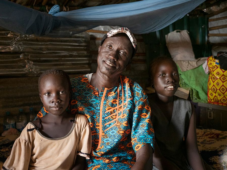 A father with two of his children.