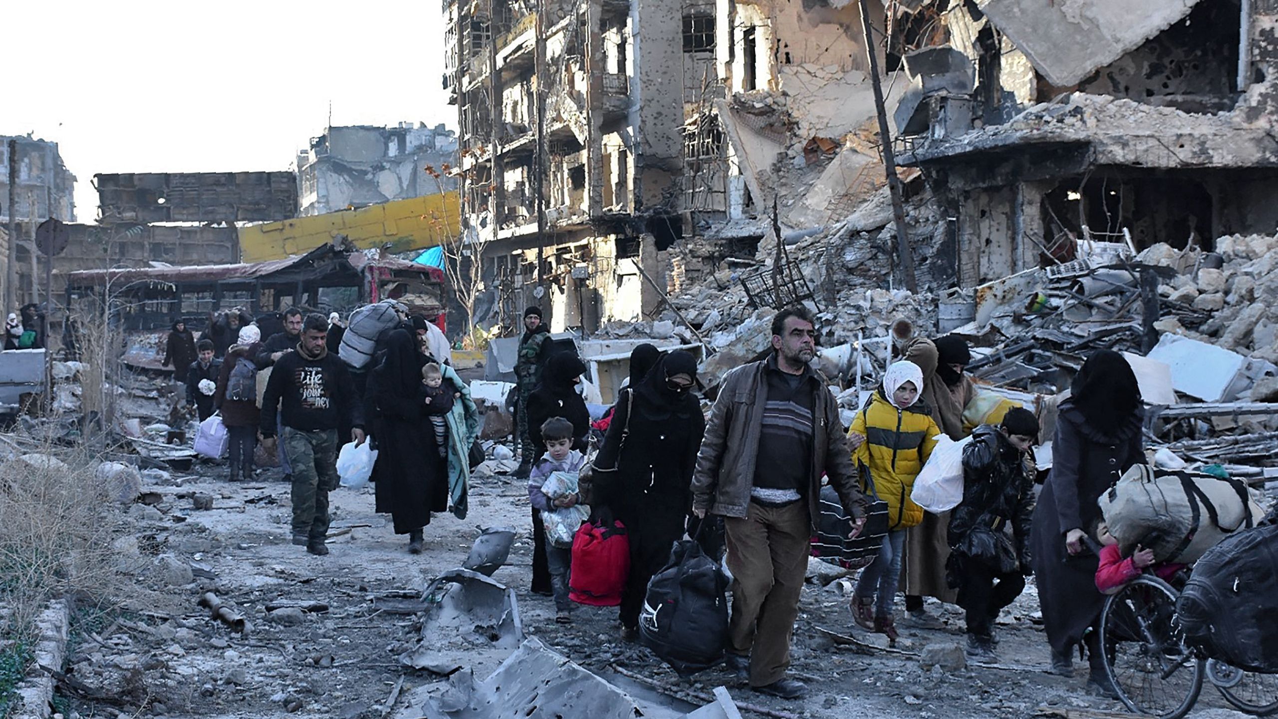 Families in the neighbourhood of Bab al-Hadid has picked up what few belongings they could carry and head for safety.